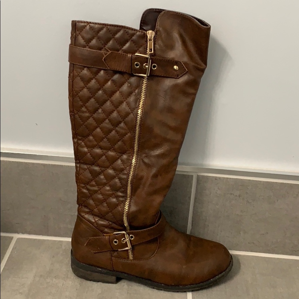 Women’s brown and gold riding boots